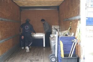 Professional movers carrying boxes during a Toronto residential move